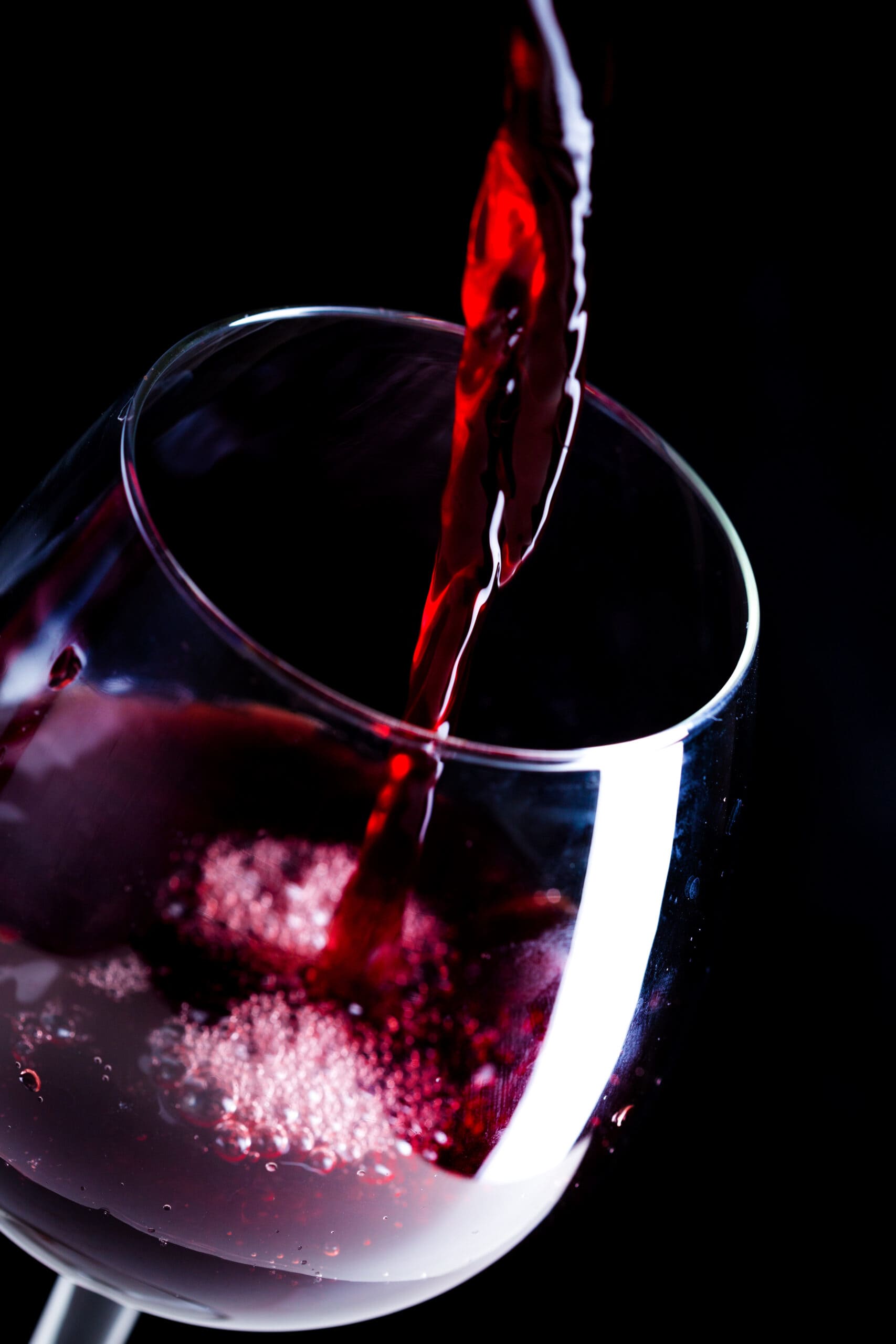 pouring-red-wine-into-glass-scaled (1)